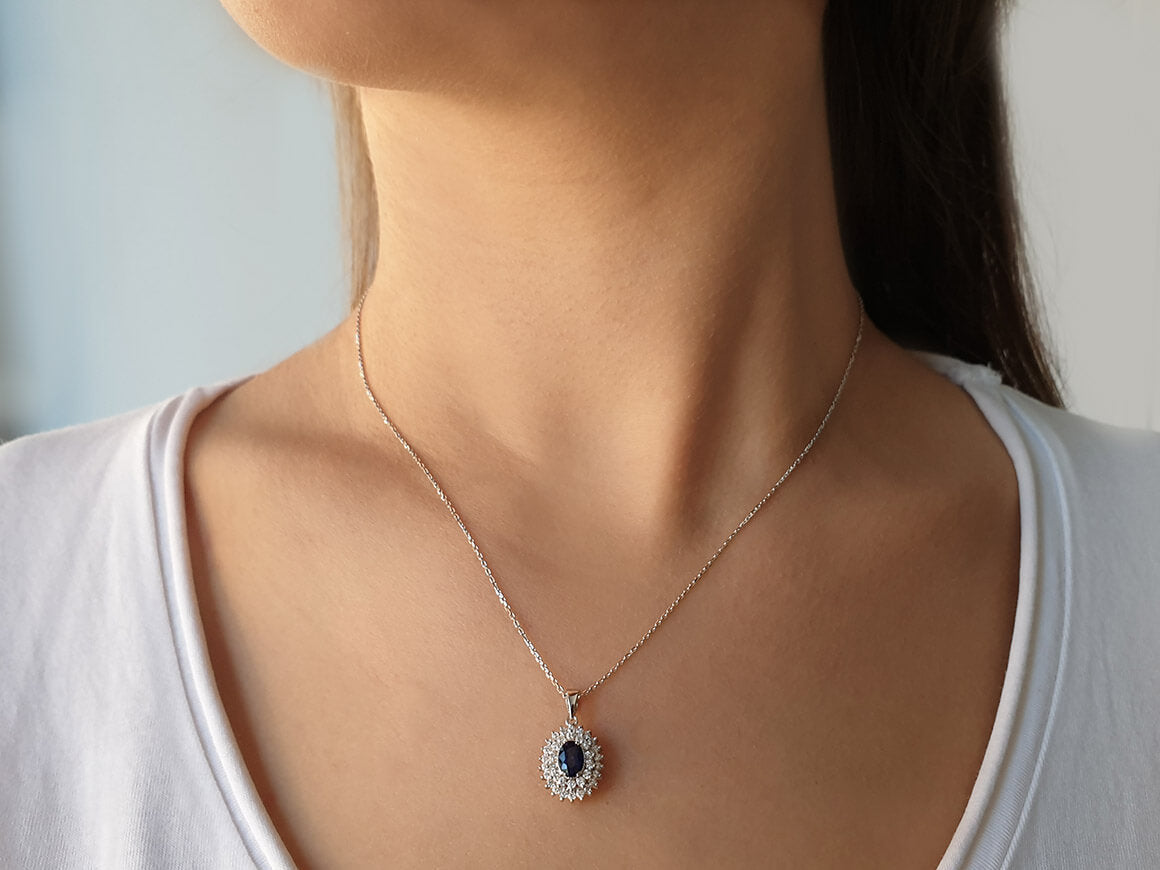 Two-row diamond and oval sapphire necklace in 14 K