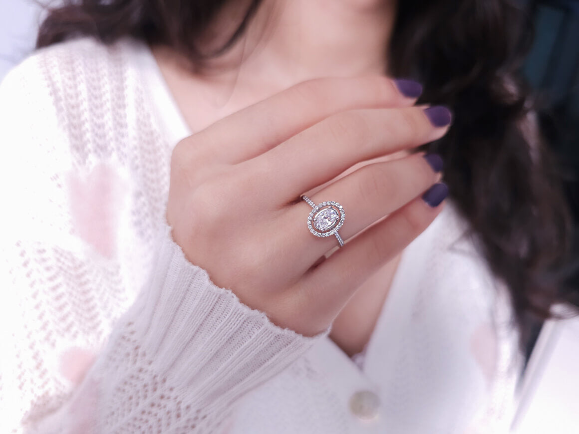 Arusha ring with diamonds and oval white topaz