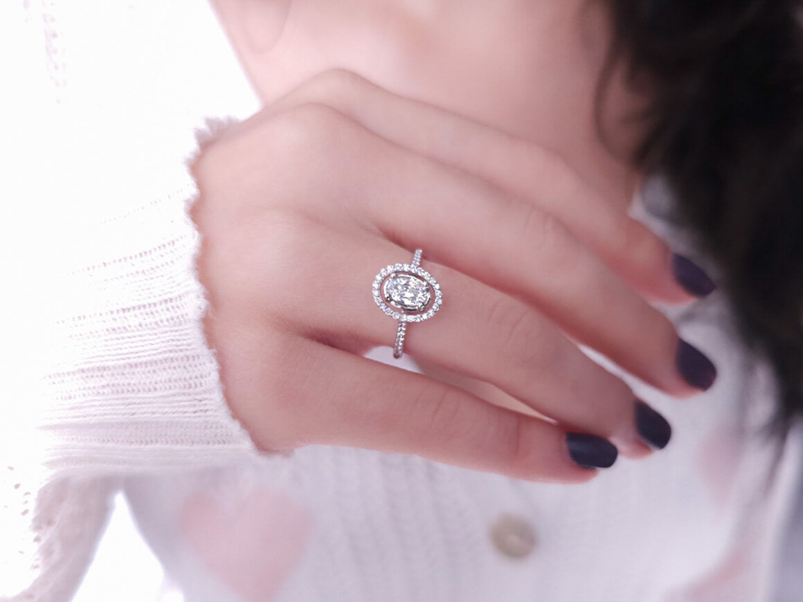 Arusha ring with diamonds and oval white topaz