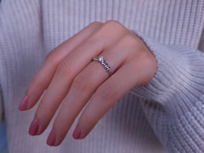 0.19 carat diamond twisted solitaire ring in 18 carat white gold