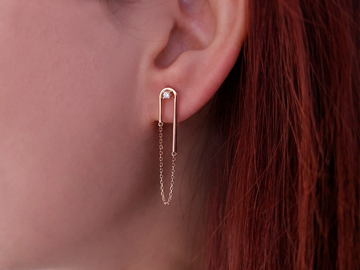0.06 carat diamond Nile earrings in 14 K red gold