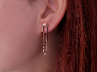 0.06 carat diamond Nile earrings in 14 K red gold