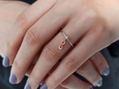 0.02 carat diamond infinity ring in 333 8 carat red and white gold