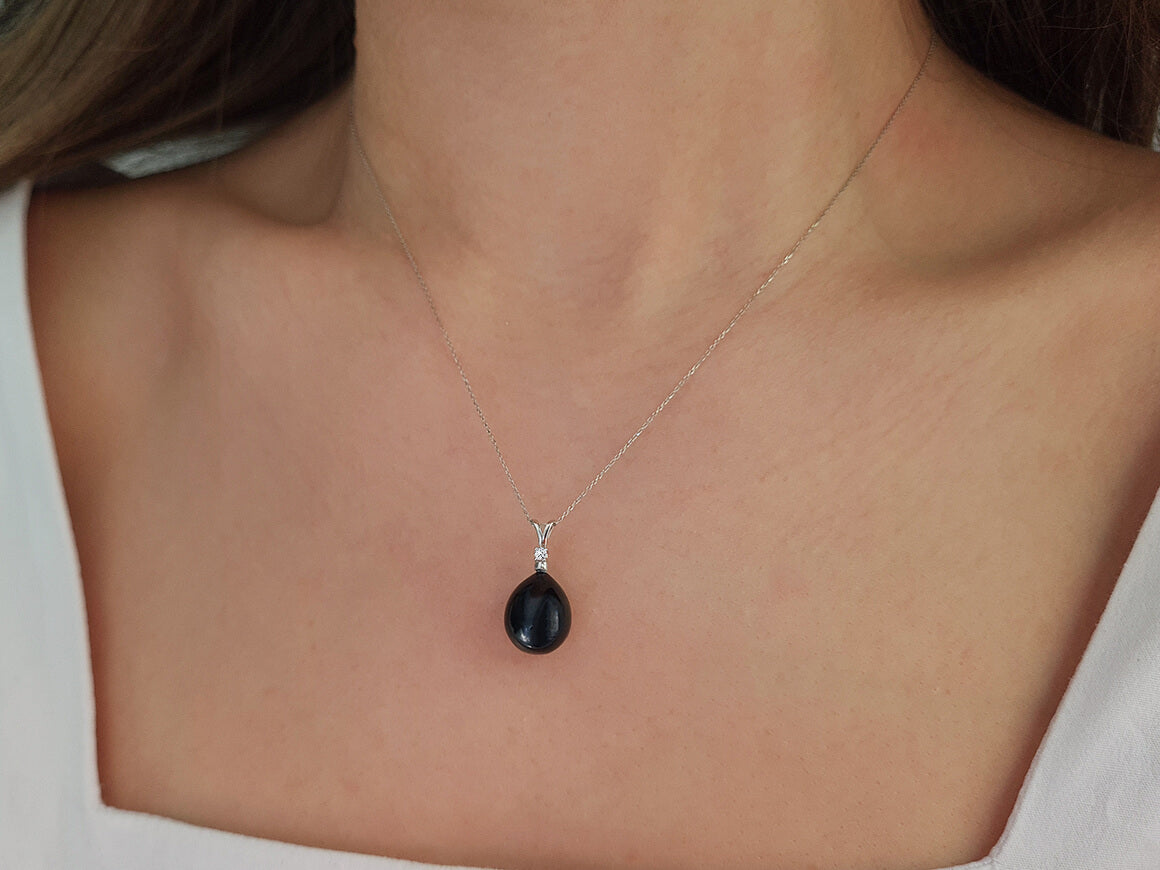 Diamond and drop black pearl necklace in 14 carat white gold