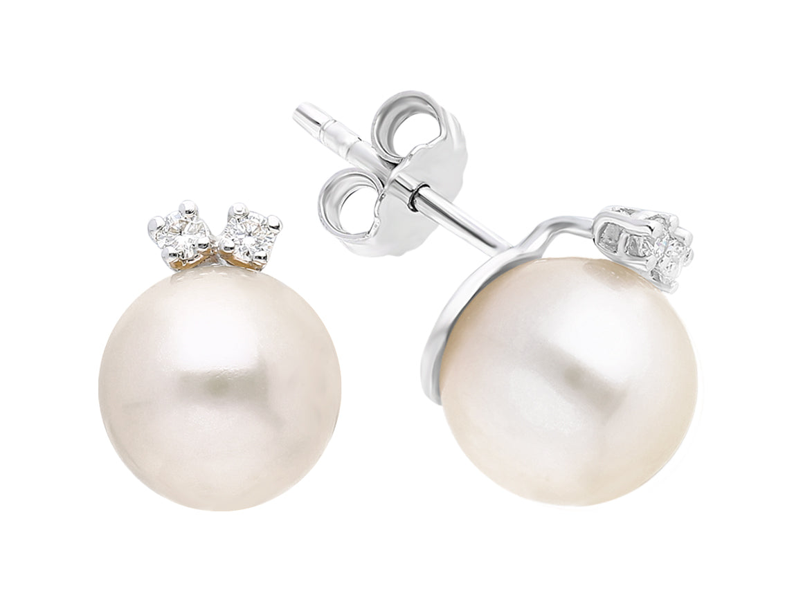 Diamond and pearl earrings in 333 8 carat white gold