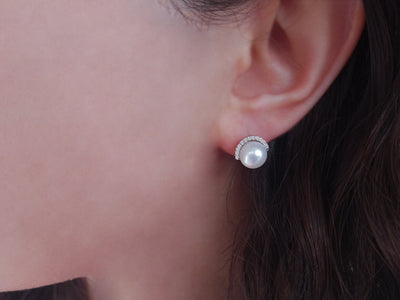 Diamond and natural pearl earrings in 14 K white gold