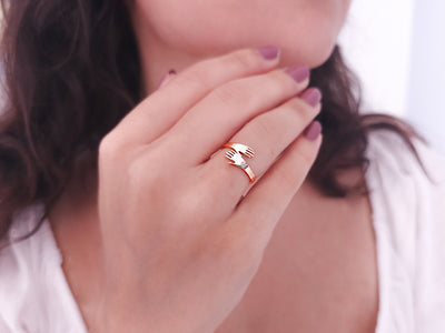 Ring with diamonds and clasped hands