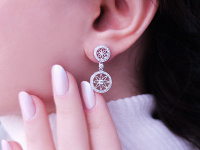 0.61 carat diamond flower of life earrings in 14 carat white gold