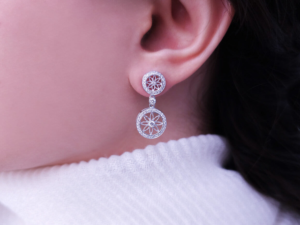 0.61 carat diamond flower of life earrings in 14 carat white gold