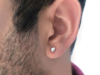 0.11 carat diamond solitaire men's earring in 14 K white gold