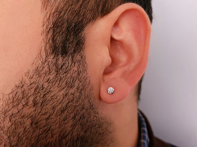 0.14 carat solitaire diamond men's earring in 14 carat white gold