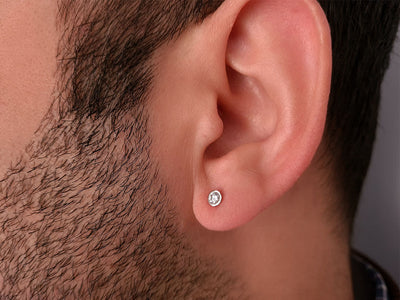 0.14 carat solitaire diamond men's earring in 14 carat white gold