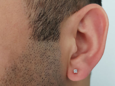 0.11 carat diamond solitaire men's earring in 14 K white gold