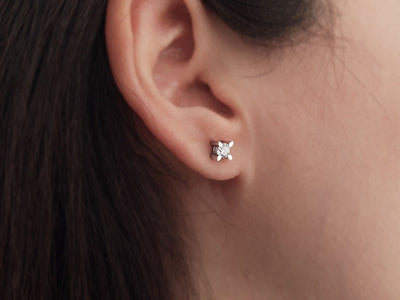 0.48 carat diamond solitaire stud earrings in 14 K white gold