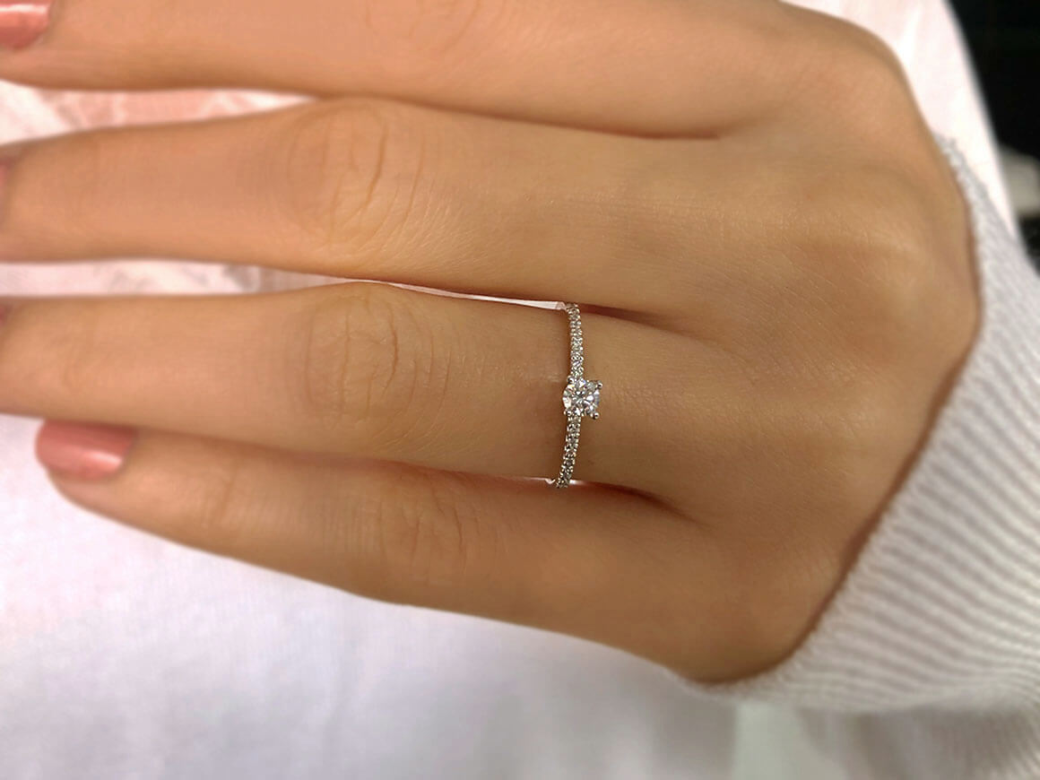 0.23 total carat diamond solitaire ring in 14 K white gold