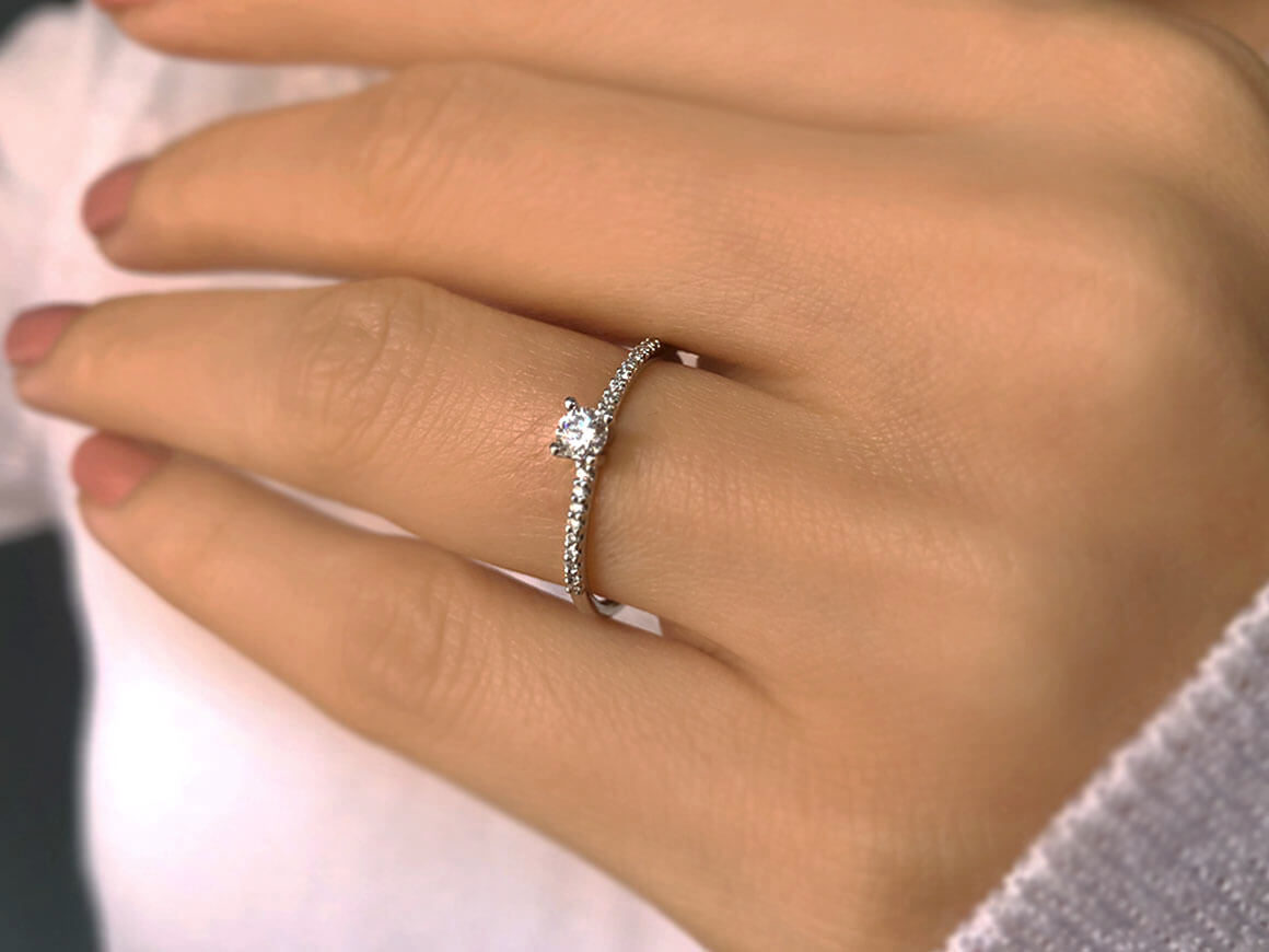 0.23 total carat diamond solitaire ring in 14 K white gold