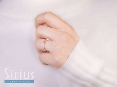 0.06 carat diamond solitaire ring in 333 8 carat white gold