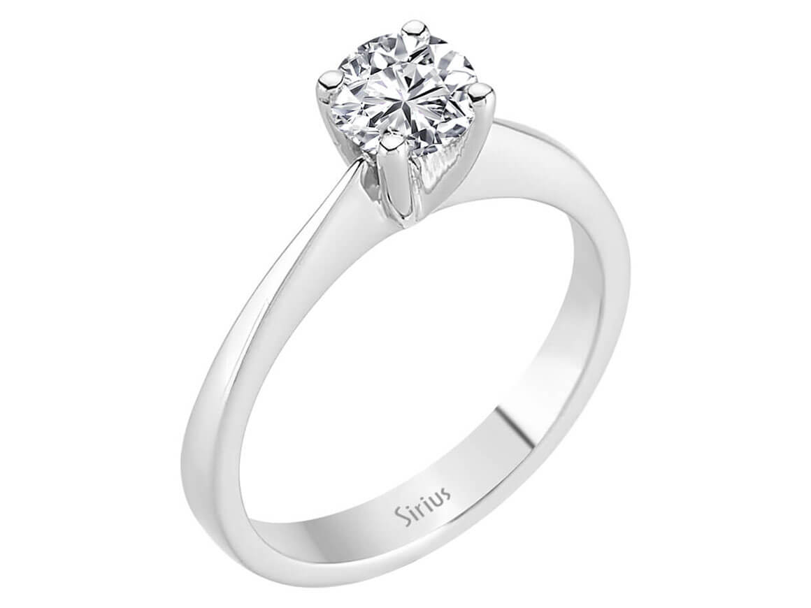 0.60 carat diamond solitaire ring in 14 K white gold