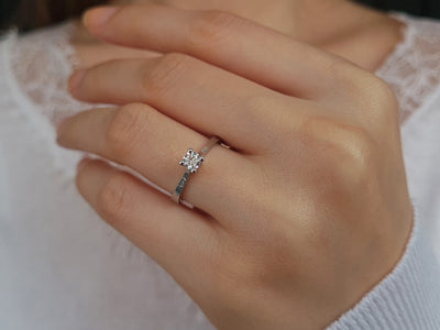 0.28 carat diamond solitaire ring in 18 K