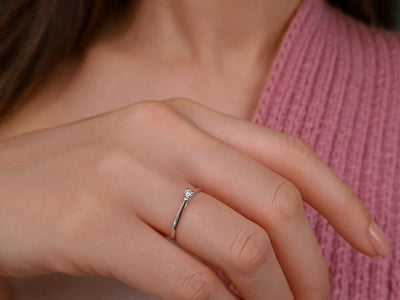 0.05 carat diamond solitaire ring in 18 K