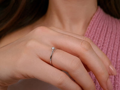 0.05 carat diamond solitaire ring in 18 K