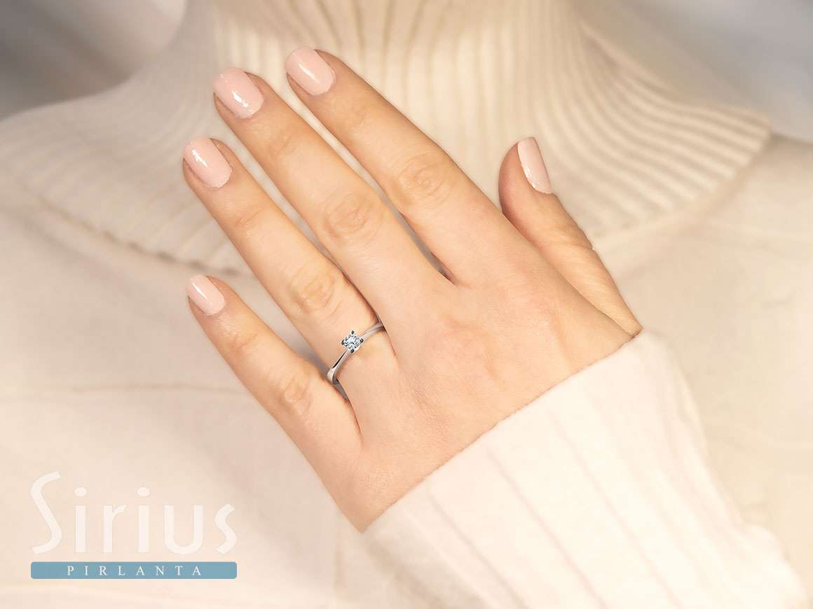 0.23 carat diamond solitaire ring in 18 K