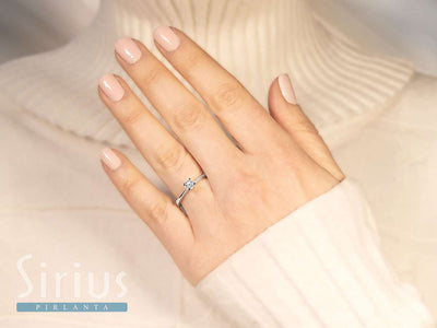 0.23 carat diamond solitaire ring in 18 K