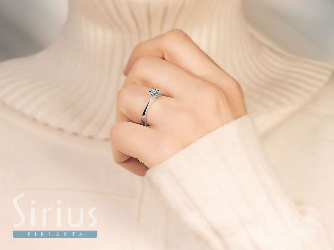 0.23 carat diamond solitaire ring in 18 K