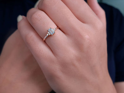 Diamond and baguette cut aquamarine ring in 14 carat red gold
