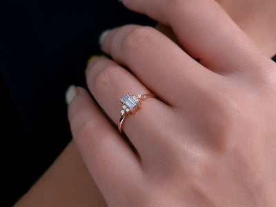 Diamond and baguette cut aquamarine ring in 14 carat red gold