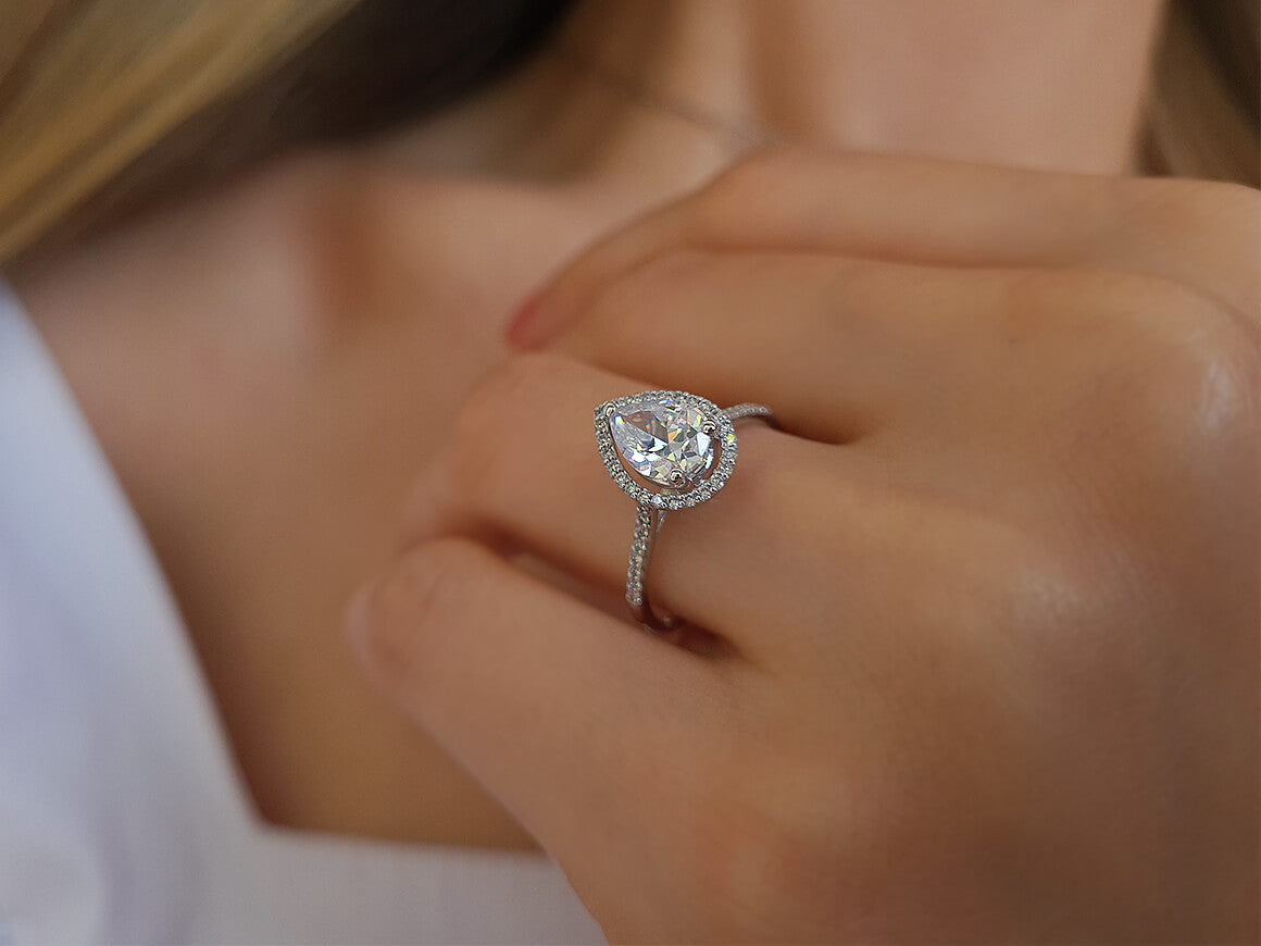 Diamond and white topaz waterdrop ring