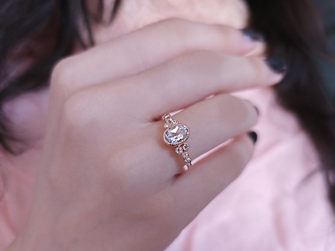 Dora ring with diamonds and oval white topaz
