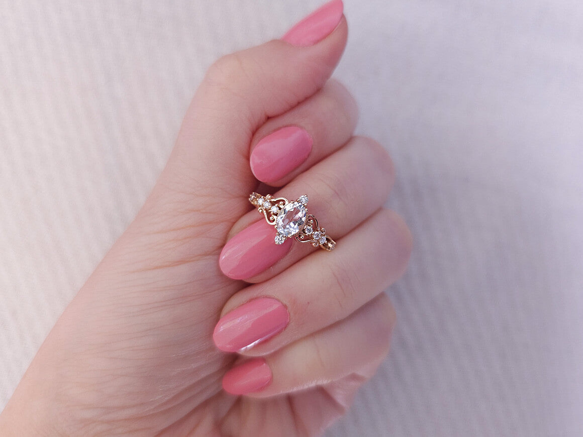 Regina ring with diamonds and white topaz stones