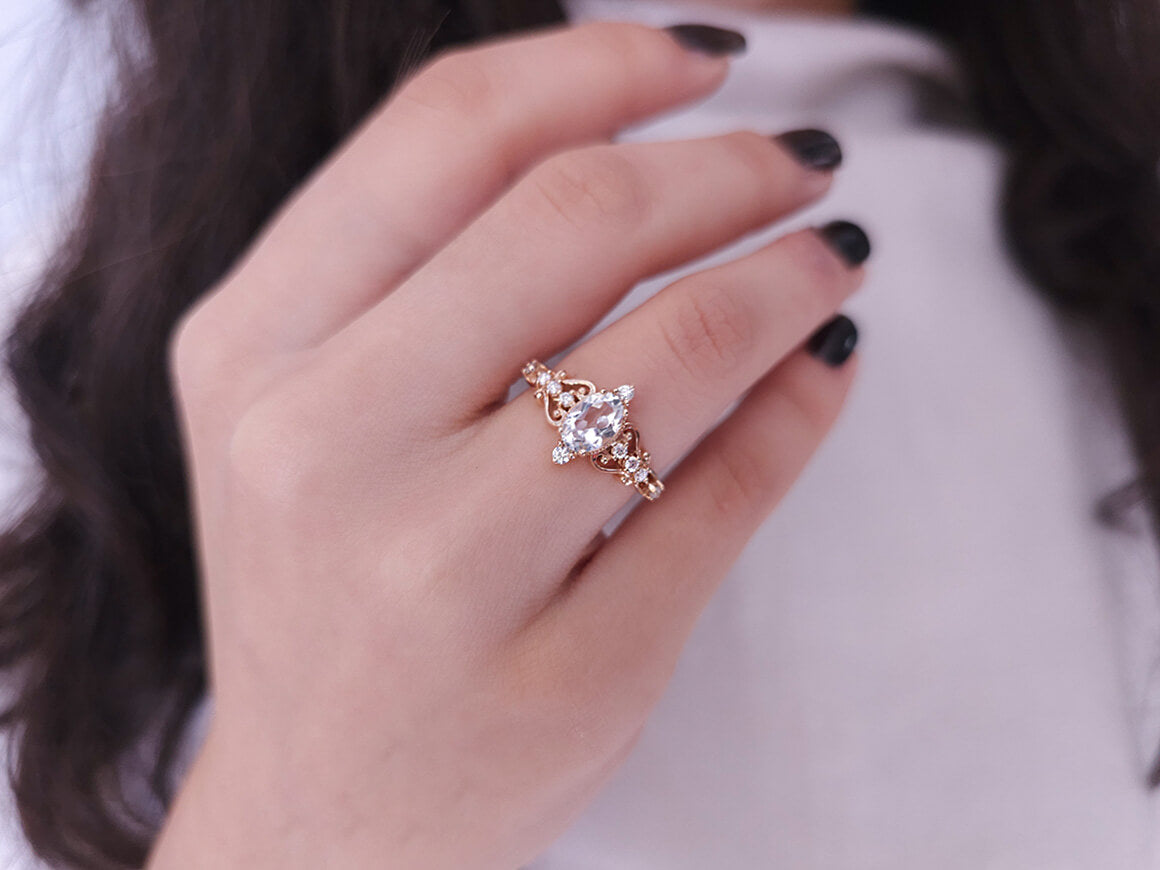 Regina ring with diamonds and white topaz stones