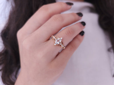 Regina ring with diamonds and white topaz stones