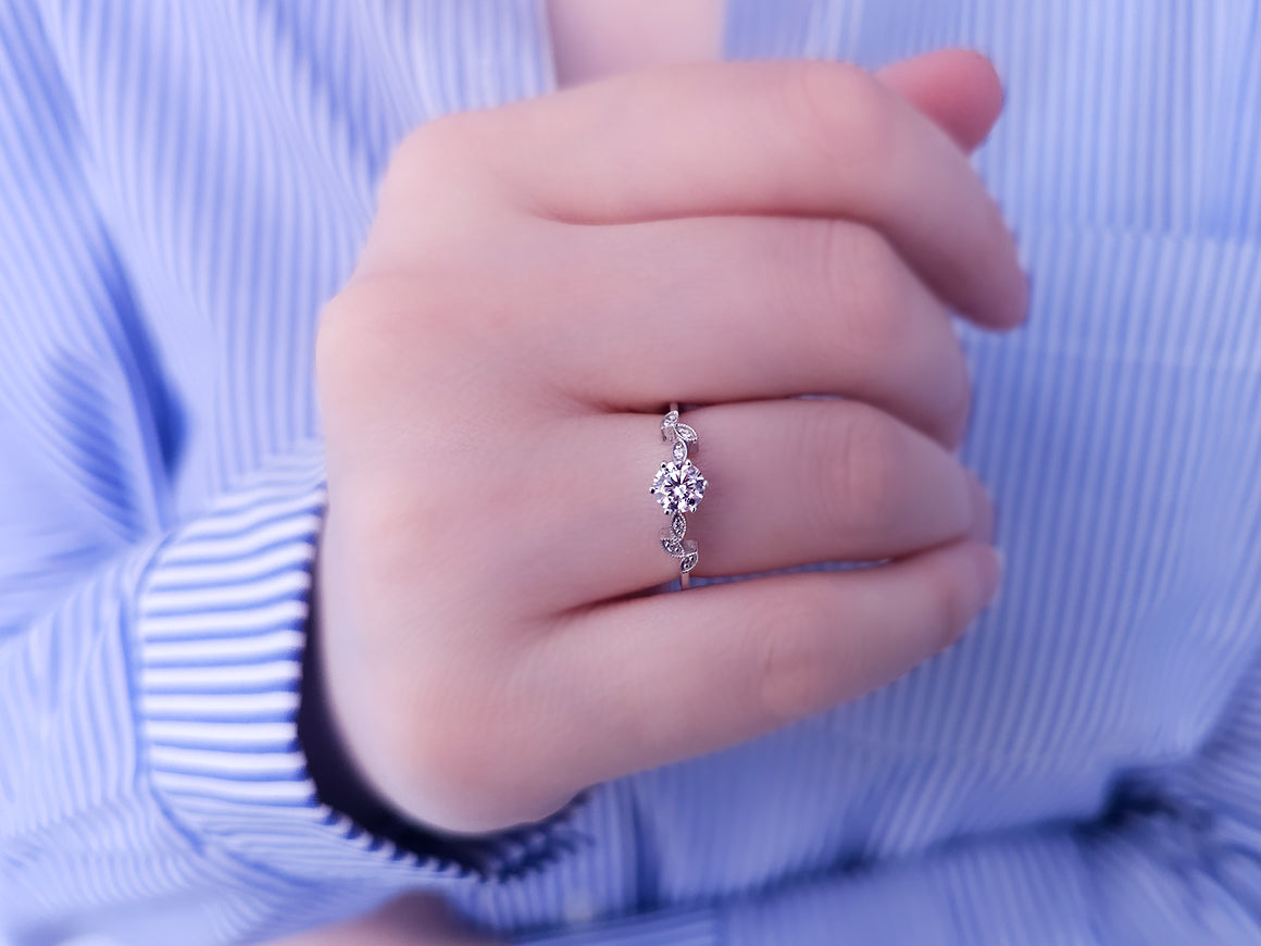 Diamond ring with white sapphire