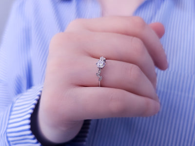 Diamond ring with white sapphire