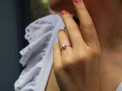 Total 0.55 carat diamond and white topaz solitaire ring
