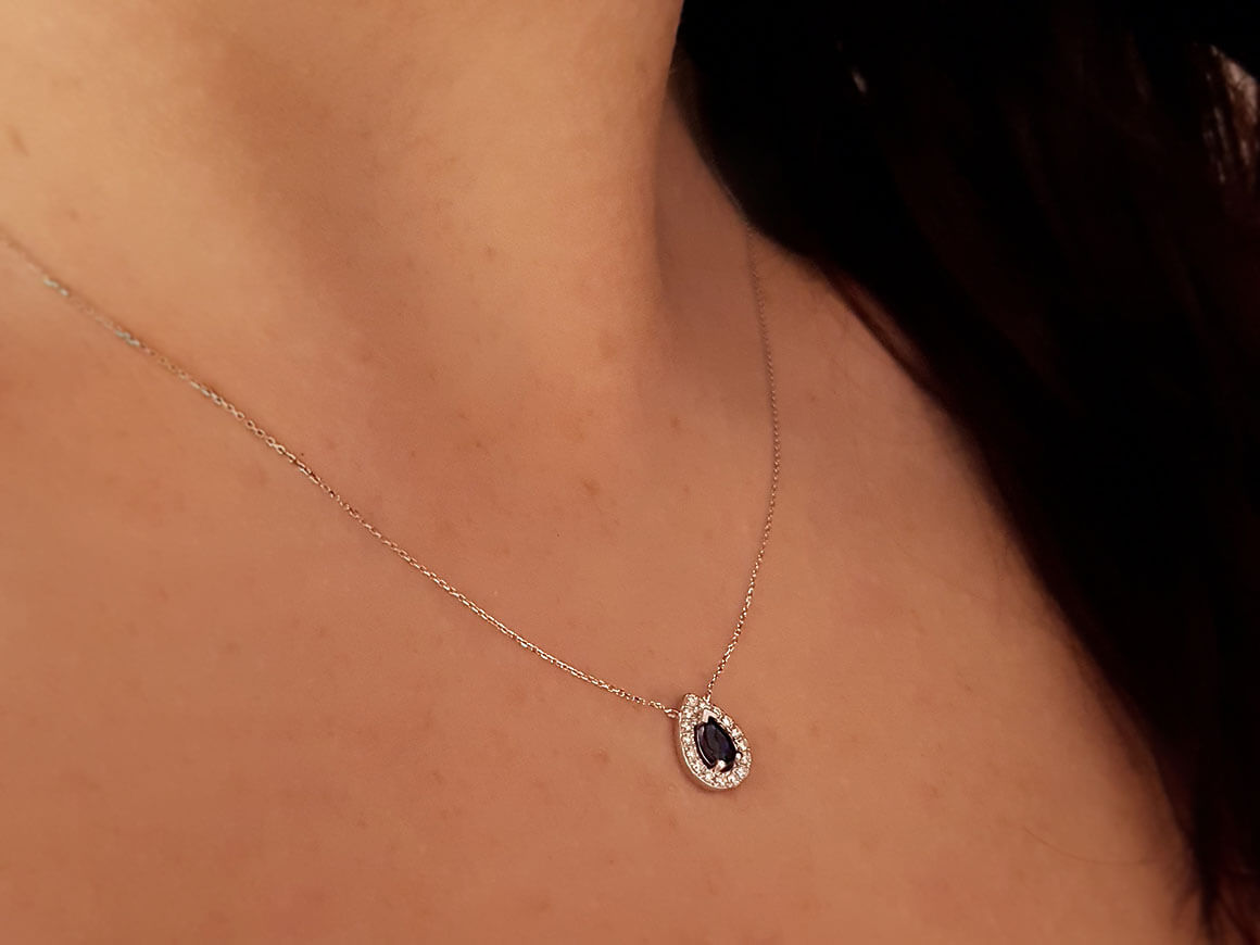 Diamond and drop sapphire necklace in 14 K white gold
