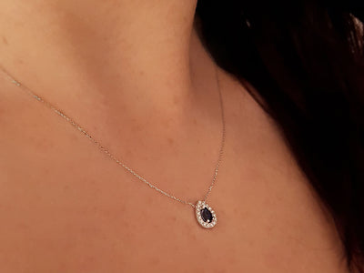 Diamond and drop sapphire necklace in 14 K white gold