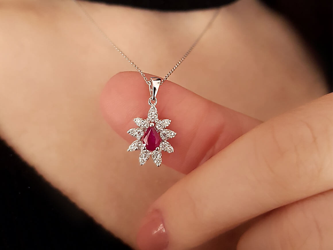 Diamond and drop ruby necklace in 14 K white gold