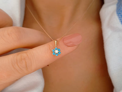 Diamond and turquoise daisy necklace in 333 8 K red gold