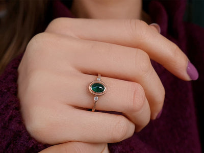 Diamond and cabochon-cut emerald ring