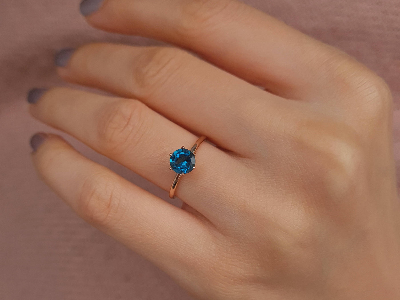 Rosetta ring with diamonds and London blue topaz