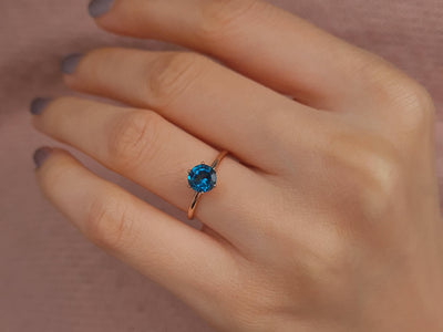 Rosetta ring with diamonds and London blue topaz