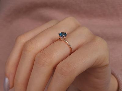 Rosetta ring with diamonds and London blue topaz
