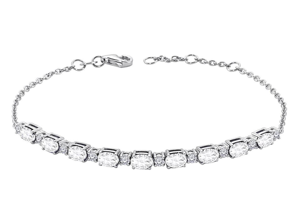 Diamond and oval white topaz bracelet in 14 carat white gold
