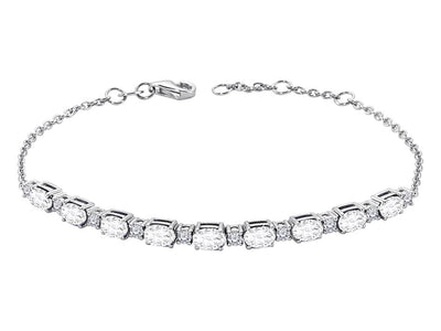 Diamond and oval white topaz bracelet in 14 carat white gold