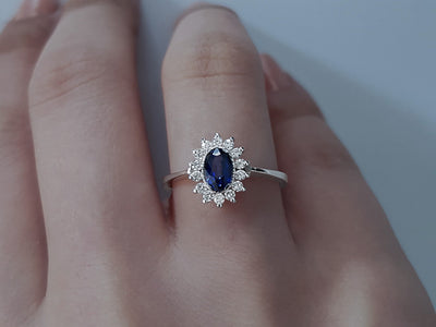 Diamond and oval sapphire jewelry set in 14 K white gold