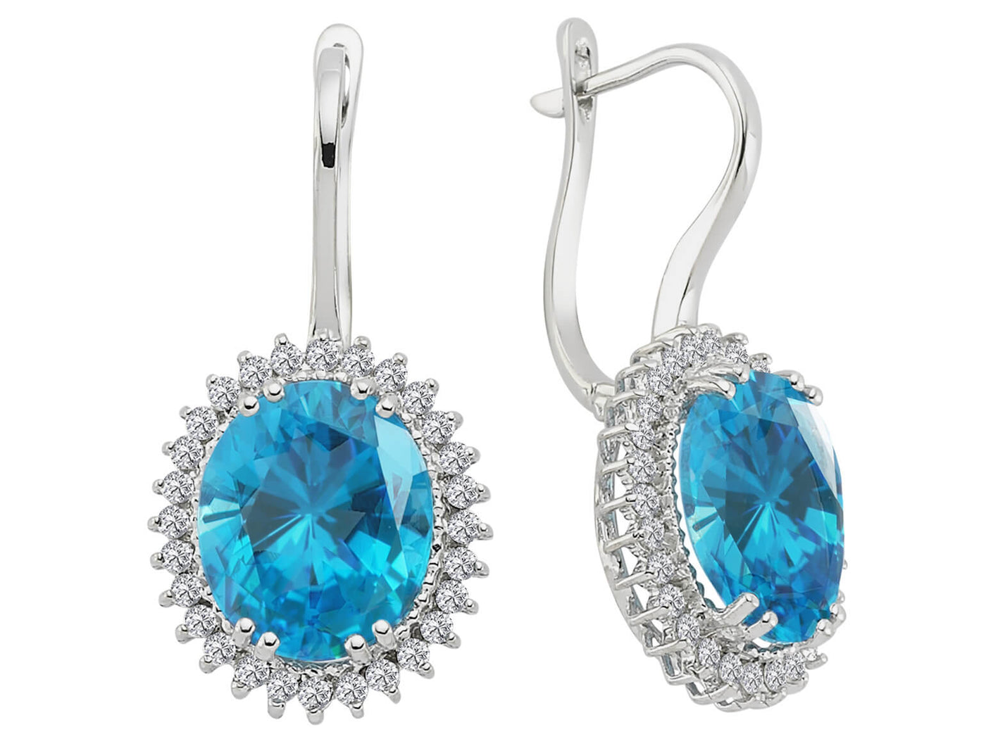 Diamond and oval blue topaz earrings in 14 carat white gold